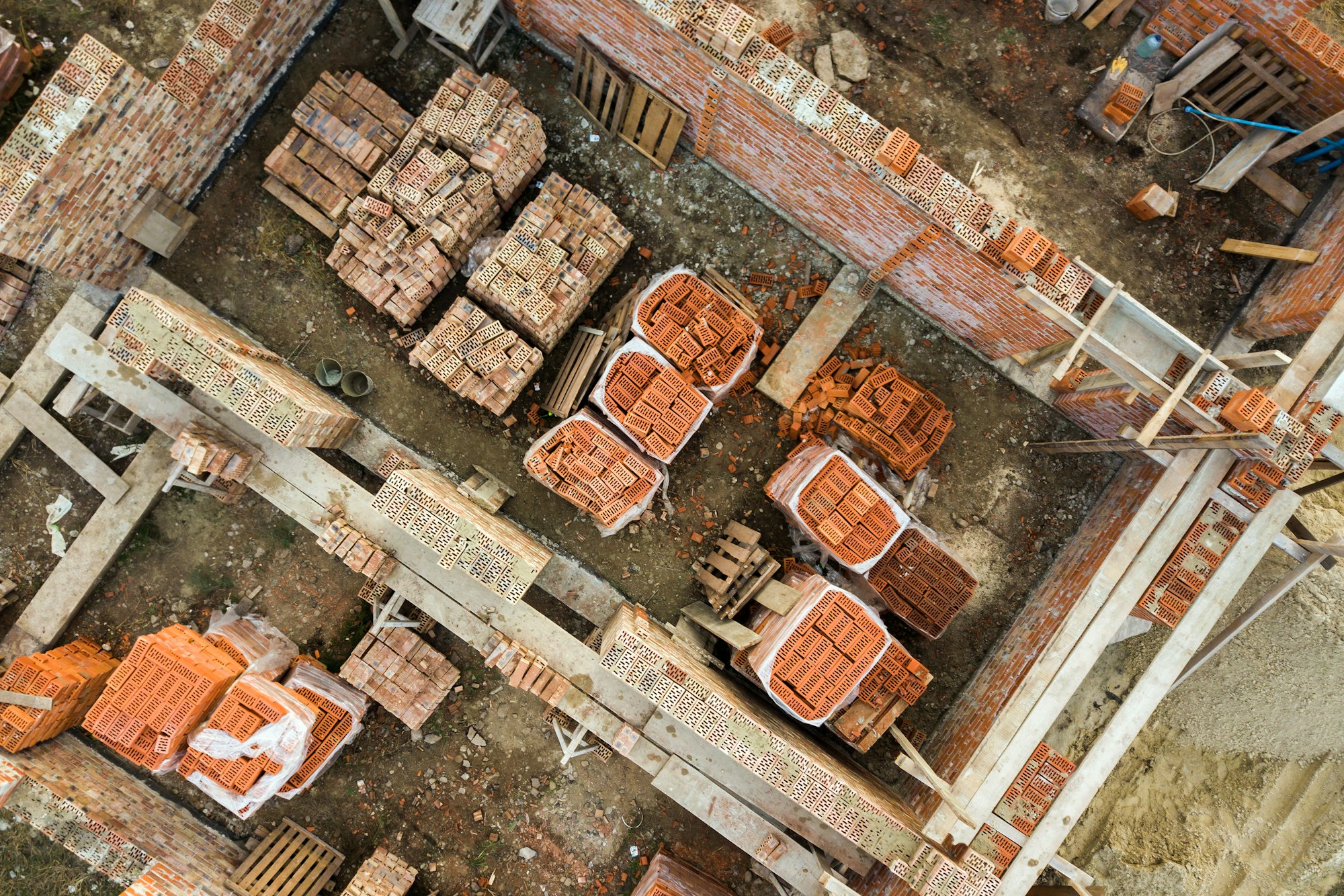 Aerial view of building site for future brick house, concrete foundation floor